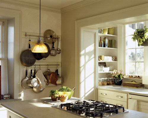 Hanging pots and pans on wall racks keeps them handy and gives you additional cabinet space.